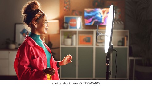 Happy woman, influencer and video recording with ring light for vlog, online tutorial or communication at home. Young, female person or vlogger talking with phone for advice, tips or content creation - Powered by Shutterstock