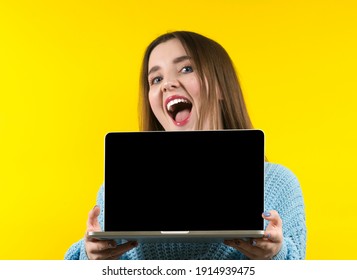 Happy Woman With Laptop Computer Isolated On Yellow Background