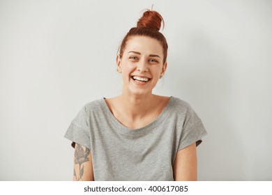 Happy woman Laughing. Closeup portrait woman smiling with perfect smile and white teeth looking laugh loudly isolated grey wall background. Positive human emotion facial expression body language.  - Shutterstock ID 400617085