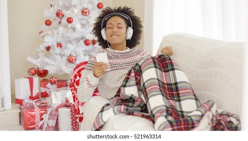 Happy Woman Listening To Music On Christmas Day