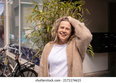 Happy Woman Living With HIV Standing Outside A Store