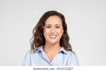 A happy woman with long, curly hair stands in a well-lit studio, featuring facial recognition markers overlaying her smiling face. - Powered by Shutterstock - Get 15% off with code: PIKWIZARD15
