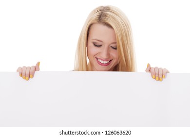 Happy Woman Looking Down At Empty Billboard