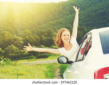 Happy Woman Looks Out The Car Window On Nature Summer