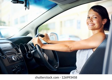 Happy Woman New Car Owner Smiling And Showing Keys In Driver Seat