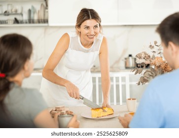 Happy woman offers young couple to try a delicious homemade pie - Powered by Shutterstock