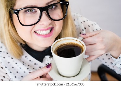 Happy Woman At Office Drinking Hot Coffee Or Tea Enjoying Her Break Time During Work. Job Relax.