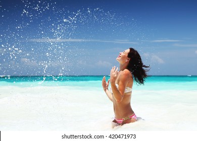 Happy Woman On The Beach, Playing In The Sea, Splashing Water, Enjoying Active Summer Vacation, Caribbean Sea, Cancun, Mexico, North America