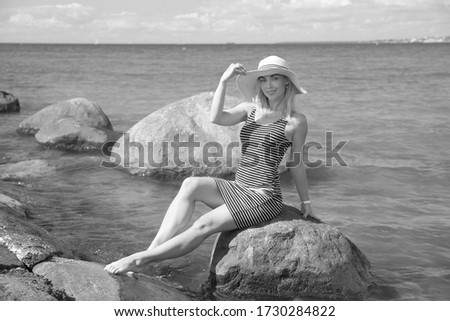 Similar – Young, long-legged, slim woman on the beach