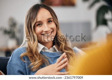 Happy woman on couch with smile for therapy, advice and help with trust, psychology and healthcare. Conversation, support and girl on sofa with therapist, psychologist and mental health counselling.