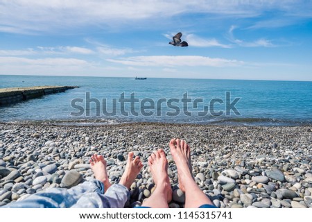 happy woman on the rocks on the beach