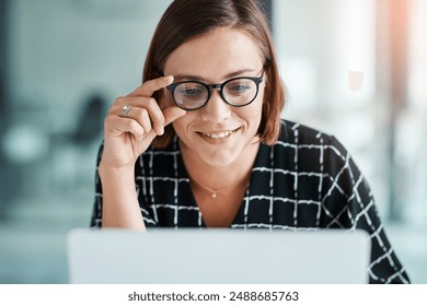 Happy, woman and online for reading in office, email and positive or good news for company growth and small business. Girl, glasses and laptop for administrative work, professional and secretary.