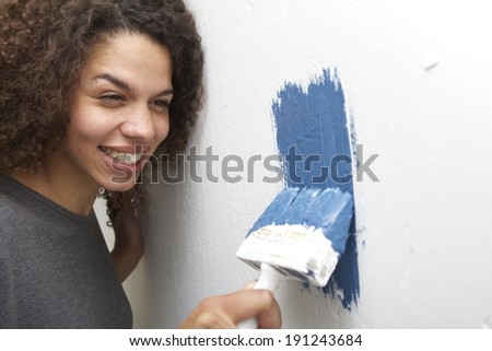 Happy woman painting