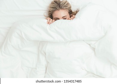 Happy Woman Peeking Under Bed Covers Stock Photo 1354317545 | Shutterstock