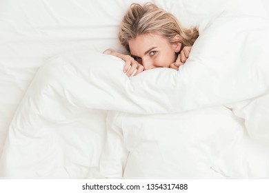 Happy Woman Peeking Under Bed Covers Stock Photo 1354317488 | Shutterstock