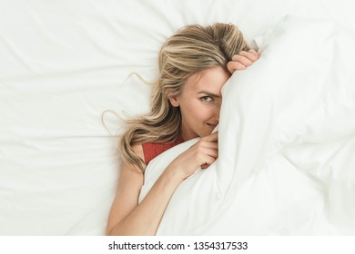 Happy Woman Peeking Under Bed Covers Stock Photo 1354317533 | Shutterstock