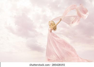 Happy Woman in Pink Long Dress, Girl with Flying Silk Scarf Cloth, Joy Open Arms Freedom concept