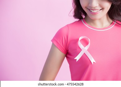 Happy Woman with pink ribbon, great for prevention breast cancer concept - Shutterstock ID 475542628