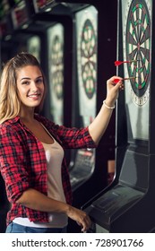 Happy Woman Playing Darts