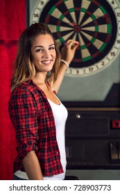 Happy Woman Playing Darts