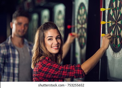 Happy Woman Playing Darts