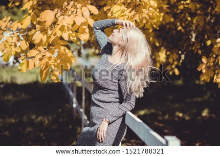 Woman with sunglasses touching over nature background