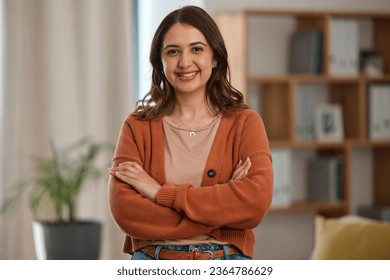 Happy woman, portrait and arms crossed of creative professional, freelancer or ambition at home. Female person smile in confidence, pride or proud for remote work or startup in living room at house