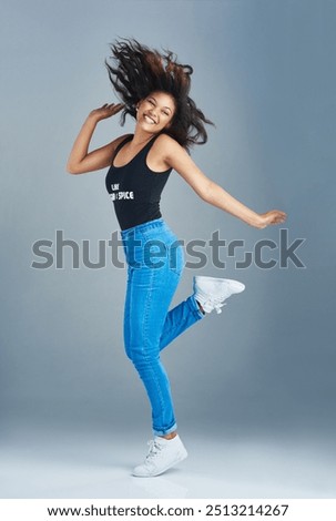 Similar – Young mixed woman with afro hair jumping outdoors.