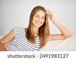 Happy, woman and portrait with stay at home holiday, rest and calm with smile in a living room. Lounge, sofa and wellness with weekend chill in France with confidence and carefree in house with peace