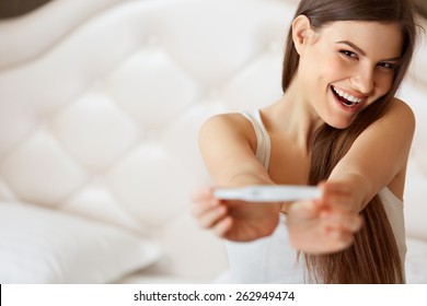 Happy Woman With Pregnancy Test 