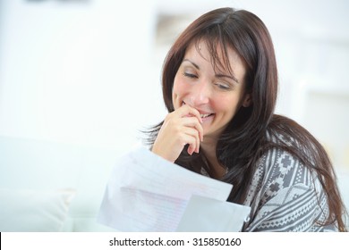 Happy Woman Reading A Letter