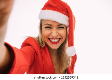 Happy Woman In Red And White Christmas Hat Do Selfie With Smile