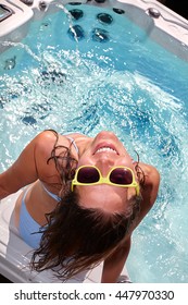 Happy Woman Relaxing In Hot Tub.