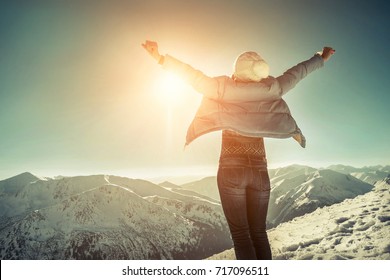 Happy Woman Relaxing On The Top Of Mountain Under Blue Sky With Sunlight At Sunny Winter Day, Travel Vacation, Landscape Mountains Background.