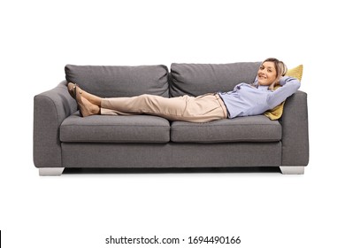 Happy Woman Resting On A Sofa After Work Isolated On White Background