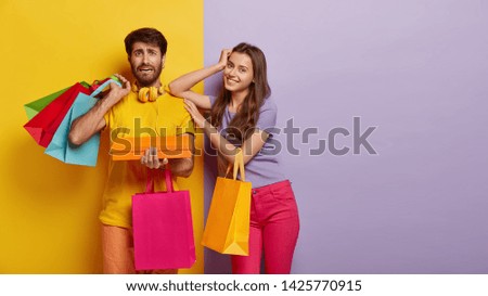 Similar – Yellow shopping bags on a blue background, Shopping concept