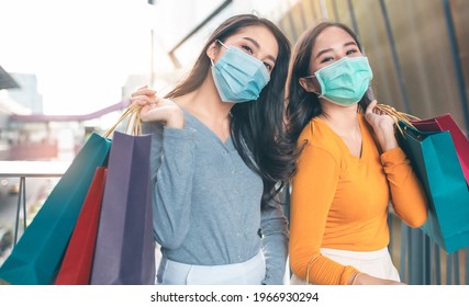 Happy Woman With Shopping Bags Enjoying In Shopping. Girl Holding Colour Paper Bag.Friends Walking In Shopping Mall.time Shopping Coronavirus Crisis Or Covid19 Outbreak.