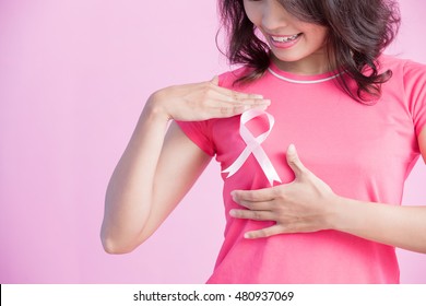 Happy Woman show pink ribbon, great for prevention breast cancer concept - Powered by Shutterstock