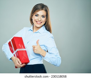 Happy Woman Show Thumb Up, Hold Red Gift Box. Business Woman Portrait Isolated. Studio.