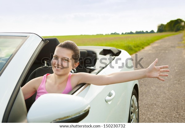 Happy\
Woman Showing Her Hand While Travelling In\
Car