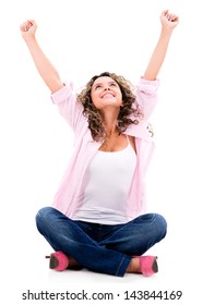 Happy Woman Sitting With Arms Up - Isolated Over A White Background
