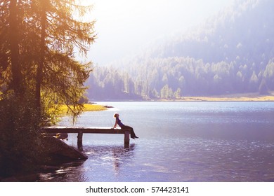 Happy Woman Sitting On The Pier And Smiling, Happiness Or Inspiration Concept, Enjoy Life