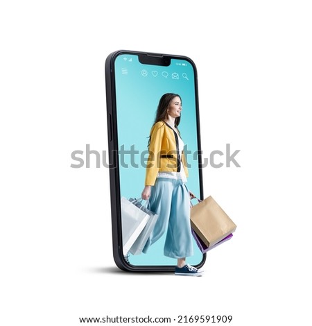 Happy woman in a smartphone walking and holding many shopping bags, online shopping concept, isolated on white background