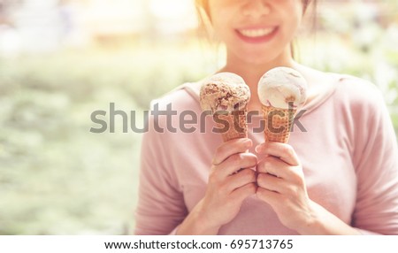 Happy woman smiling while holding ice cream have fun and good mood in summer. copy space