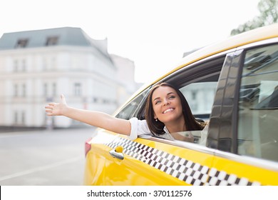 Happy Woman In A Taxi