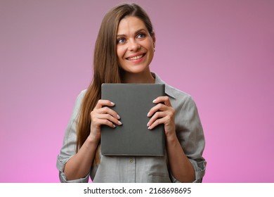 Happy woman teacher or student girl holding book in front of and looking up, isolated female portrait.