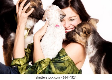 Happy Woman With Three Adopted Street Dogs, Studio Shot