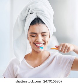 Happy, woman and toothpaste with brushing teeth in bathroom for oral hygiene, health and cleaning. Toothbrush, towel and person with smile for fresh breath, dental care and morning routine at home - Powered by Shutterstock