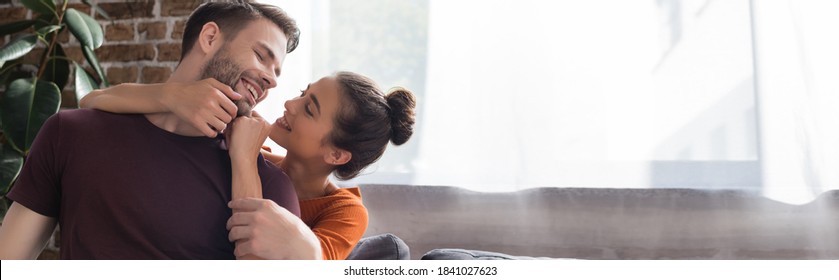 Happy Woman Touching Face Of Smiling Man At Home, Banner