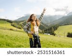 Happy Woman tourist admiring the landscape mountains nature. Exploring wilderness in National Park. Travel, hiking concept.